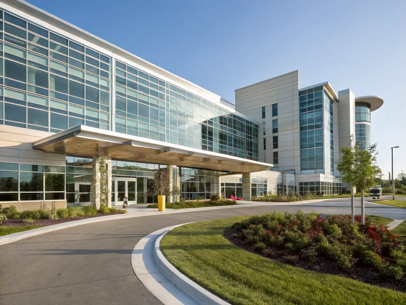 A modern hospital exterior during daytime, showcasing its architecture and the bustling activity around it, symbolizing a partnership with Global Healthcare Solutions.